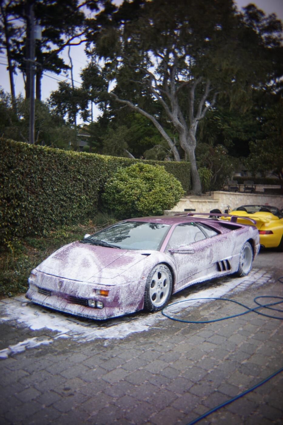 A purple Lamborghini under foam
